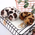Fur ball key chain love car pom leopard print hair new heart shaped fluff ball keychain ladies bag pendant key ring jewelry. 