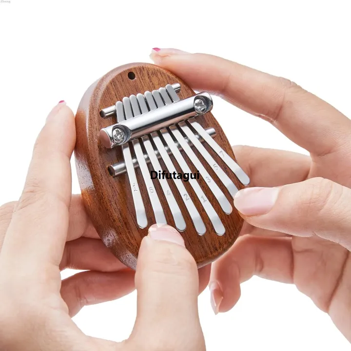Difutagui%20Zheng%20Set%20Gift%20Portable%20Musical%20Instrument%20Drop%20Bag%20Thumb%20Kalimba%202025%20New%20Sales%20promotion%20Mini%208%20Key%20Piano%201%20Style%20Cute%20and%20Beautiful%20Kids%20-%20Image%208