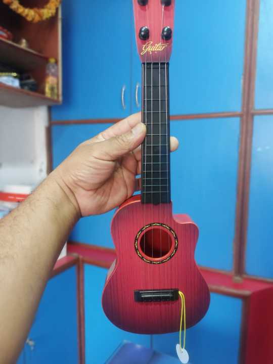 Combo%20Offer%20for%20Kids:%204-String%20Acoustic%20Guitar%20Toy%20And%20Mini%20Children's%20Electronic%20Piano%20-%20Educational%20Musical%20Instruments%20For%20Beginners%20-%20Image%207