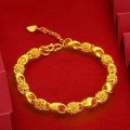 Sand gold jewelry light luxury high-end hollow transfer bead exquisite bracelet women's design sense simulated gold hand jewelry wholesale. 