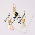 Difutagui Cute Mini Daisy Keychain for Women Handbag Trinkets Bluetooth New style Headset Pendant Key Ring DIY Friendship Gifts. 