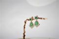 Diamond Earing with Emerald. 
