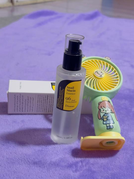 "Disaar Snail Mucin Essence Serum 100ml: A Powerful Skincare Solution for Radiant and Healthy Skin" with small potable mini fan gift