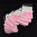 DISICHEN Fashion 50 Pcs 7*10cm/7*7cm Cute Pink Bow Design Cake Gift Packages OPP Bags Plastic Candy Cookies Biscuits Bags Wedding Party Supplies. 