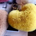 Fur ball key chain love car pom leopard print hair new heart shaped fluff ball keychain ladies bag pendant key ring jewelry. 