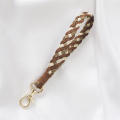 construction Wristband keychain Handcrafted Microfiber material Woven design Hand woven key charms Leather details Plaid. 