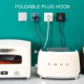 Multi-purpose Hooks Strong Adhesive Power Plug Socket Hanger Holder Wall Hanging Hook Folding Kitchen Storage Rack. 