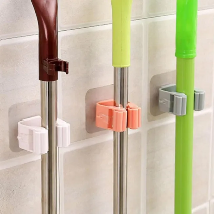 Wall%20Mounted%20Mop%20&%20Broom%20Holder%20%E2%80%93%20Self-Adhesive,%20Waterproof%20Multi-Tool%20Organizer%20Rack%20with%20Hooks%20%E2%80%93%20No%20Drill,%20Space-Saving%20Storage%20Solution%20for%20Kitchen%20&%20Bathroom%20Cleaning%20Tools%20-%20Image%202