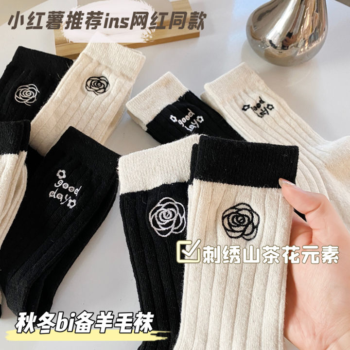Medium socks women's winter thick small fragrance embroidery camellia cashmere socks ins tide black and white wool socks wholesale