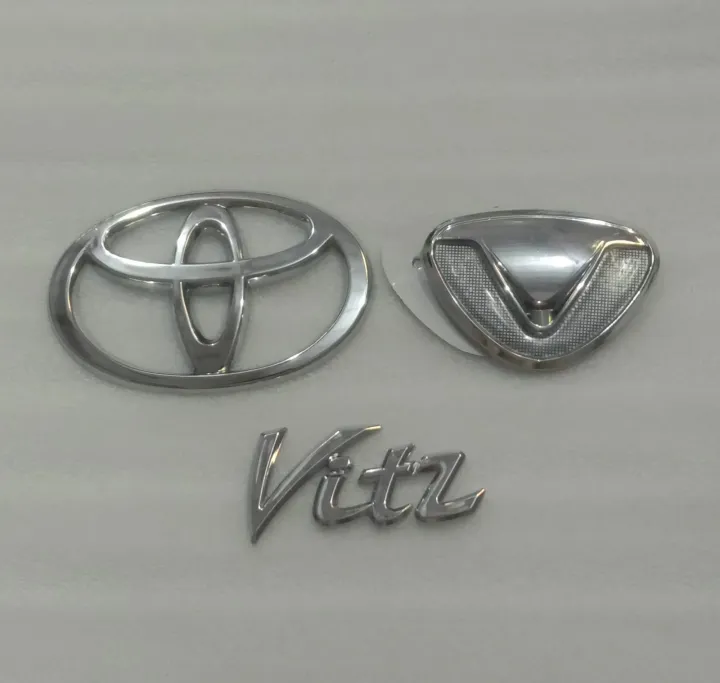 Toyota%20Vitz%201999-2004%20Front%20Grill%20Logo%20Monogram%20with%20Back%20Logo%20Complete%20Set%20Monograms%20Emblems%20-%20Image%202