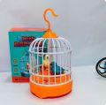 Voice Control Bird Cage Toy – Talking & Singing Electric Mini Parrot with Light & Sound | Hand Sensor Chirping Bird Toy for Kids | Realistic Electronic Birdcage. 
