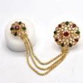 stylish double ring with green and maroon nug. 