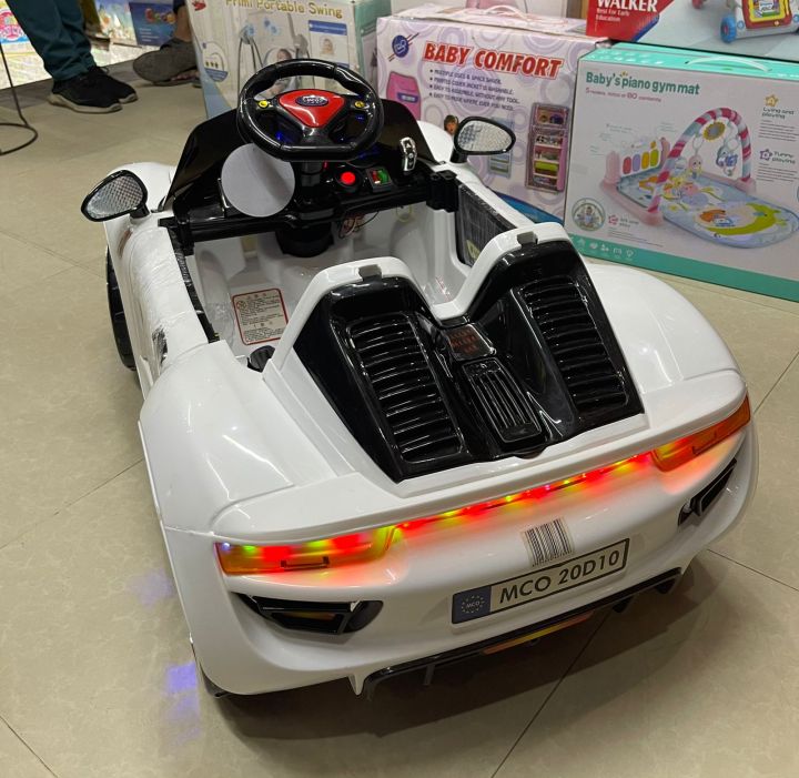 Kids%20Electric%20Car%20Remote%20and%20Self-Drive,%20Door%20Open%20option%20Push%20Start%20With%20Music%20USB%20Option,%202%20Battery%203%20Motors,%20With%20Rocking%20Wide%20Sitting%20Space%20Imported%20Made%20-%20Image%202