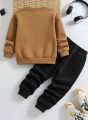 "Kids Winter Tracksuit - Cute Teddy Bear Printed Sweatshirt & Jogger Set for Boys & Girls (2-Piece)". 