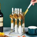 Openi - 24 Pcs Household Cutlery Set with Hanging Rack - Independent Storage And Easy To Use - Durable Stainless Steel Material - Fork, Spoon, Knife, Tea Spoon Set And White Marble Design Handle. 