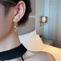Korean fashion diamond studded bow earrings women's autumn and winter niche personality versatile long tassel stud earrings earrings trendy. 