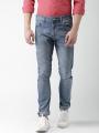 The-Ajmery Medium Blue Ripped Denim Jeans For Men. 