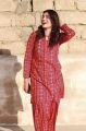 woman wears girls cloth unstiched Lawn printed :chunri print Fabric*LAWN Fabric Quality:90/70 Description  2PC Suit. 