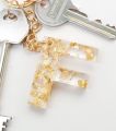 1x keychain- golden / silver- Initial keychain- glittered with foil- fancy keychain- Resin- Epoxy. 