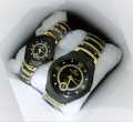 A classic analog wristwatch with a white dial, black Arabic numerals, and a white leather strap.. 