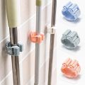 Wall Mounted Mop & Broom Holder – Self-Adhesive, Waterproof Multi-Tool Organizer Rack with Hooks – No Drill, Space-Saving Storage Solution for Kitchen & Bathroom Cleaning Tools. 