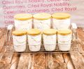 7-Piece Airtight Ceramic Canister Set with 3 Large and 4 Small Canisters on Metal Rack. 