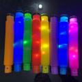 colorful glow light up rainbow pop tube fidget toy sensory for stress relief birthday cake pop tubes fidget toys. 