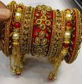 Indian Style Bridal Red Bangles Set Hand Crafted with Love Bridal Bangels with Latkan 11 Pieces Set for New Brides Hand Made Fancy Bangles for Girls and Women Bridal Kundan Chura Bangals Indian Bride Kangan Set Traditional Bride Set for Girls and Women. 