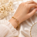 Floral Link Bracelet – Signature Gold Tone Wrist Piece for Women. 