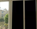 PLAIN BLACK TINTED GLASS PAPER BLOCKS UV LIGHT RAYS 50% BLOCKAGE OF SUNLIGHT AESTHTICS TRANSFORM WINDOWS AND DOORS USE ON CARS WINDOWS AND ANY WHERE YOU FEEL RIGHT WATER PROOF SOLAR FILM. 