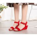 Vibrant Red Sandals with a Buckle Closure that Open at the Toe. 