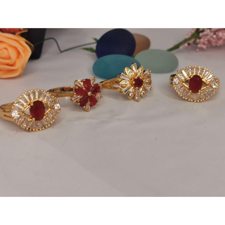 1k  bridal gold ring with maroon stone.