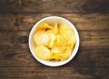 crispy , salty and plain bakery chips in a pack of 4. 