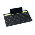 WIRELESS BLUETOOTH KEYBOARD WITH PHONE/TABLET HOLDER SLOT. 