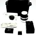 Nikon J1 Mirrorless Camera with 10-30 mm lens - White. 