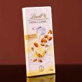 LINDT SWISS CHOCOLATE WHITE ALMOND 100 GM. 