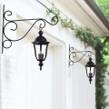 A metal stand for hanging flower pots on your garden wall. It's like a shelf with hooks for your pots.. 