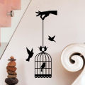 Hand hoHlding Bird Cage Wall Sticker. 