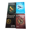 the hunger games 4 books set by suzanne collins ( the hunger games , catching fir , _mockingjay , the ballad of songbirds and snakes). 