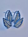 Beautiful Ear Rings in leaf / petal shape with elegant white sapphire stones in dark blue color. 