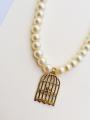 Girls beautiful pearl necklace with cage pendant with cream colour. 