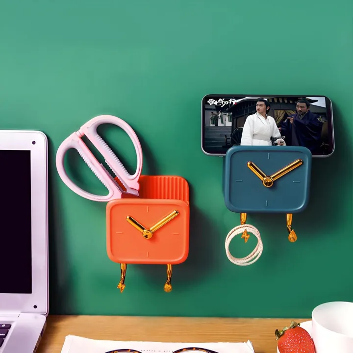 One%20Multipurpose%20Clock%20Shape%20Wall%20Mobile%20Holder%20Self%20Adhesive%20With%202%20Hook%20%7C%20Mobile%20Charging%20Stand%20%7C%20Home%20Decoration%20Item%20Keys%20Hanging%20Hooks%20%7C%20Wall%20Mount%20Hanging%20Stand%20For%20Keys%20%7C%20Home%20AC%20TV%20Remote%20Holder%20%7C%20Wall%20Mounted%20Self%20Adhesive%20Key%20Holder%20Multi%20Colors%20-%20Image%204