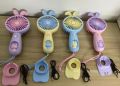Rechargeable Mini Handy Rabbit Style Fan with Assorted/Random Color Options, Portable Design, and Quiet Operation. 