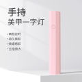 Handheld nail art lamp, small portable nail art light, ultraviolet quick-drying mini light therapy lamp, nail chip sticking diamond baking lamp. 