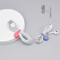 Universal cable manager for headphones, data cable storage artifact, portable magnet buckle, charging cable, anti-tangle cable management belt. 
