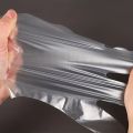 100pcs Disposable Gloves For Food, Individually Wrapped Plastic Transparent Gloves, Film Thickened PE Gloves. 