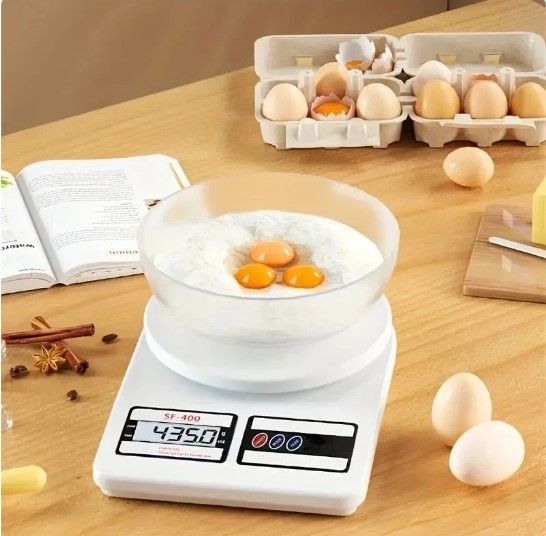 Electronic%20Digital%20Kitchen%20Weighing%20Machine:%2010kg%20Weight%20Scale%20with%20Backlit%20LCD%20(Shop,%20Food,%20Cake,%20Kids%20Food,%20Spices,%20Vegetables,%20Liquids,%20Chicken,%20Fruits)%20-%20White%20-%20Image%204