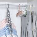 Magic Hanger - 9 hole closet organizer - space saving magic plastic hangers - organizer 9 hole hangers for clothes paints trousers shirt hanger 9 in 1 hangers - Multi Purpose Hanger - Clothes Plastic Hanger - High Quality Hanger. 
