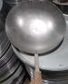 black iron Chinese fried rice and Manchurian wok with wood handle  a lifetime warranty. 