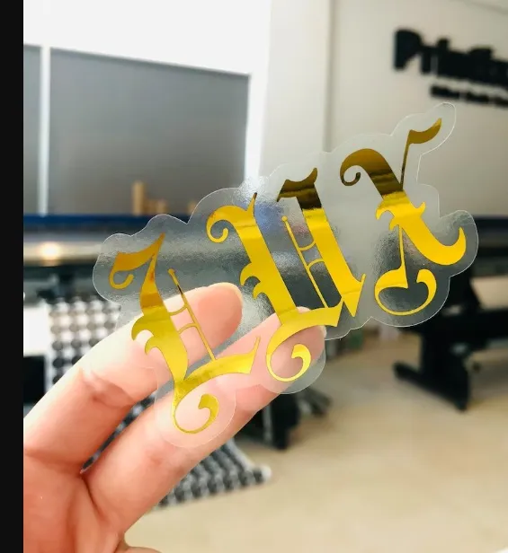 Gold%20Foil%20Printing,%20Gold%20Clear%20Custom%20Stickers,%20Transparent%20Stickers,%20Any%20Shape%20Custom%20Stickers,%20Logo%20Labels,%20Custom%20Product%20Labels%20-%20Image%202